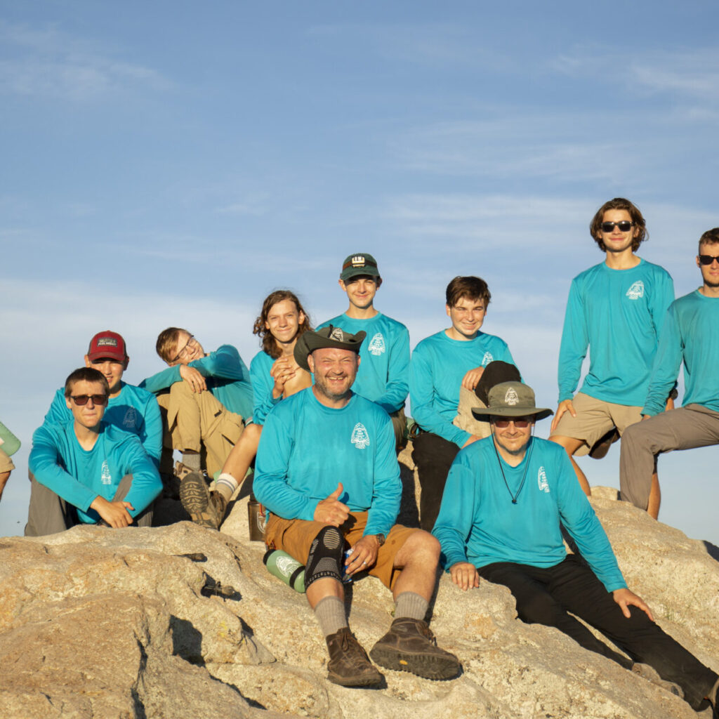 Crew 710-P-02 poses for a portrait at the summit of the Tooth of Time at Philmont Scout Ranch on July 21, 2022 in Cimarron, N.M.