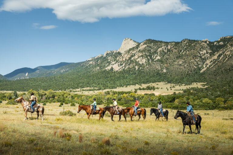 The Autumn Family Adventure camp horse ride passes by the iconic Tooth of Time at Philmont Scout Ranch on September 14th, 2024.