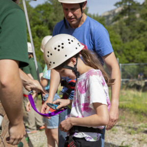 PTC participants and family camp explore the high ropes course at rocky mountain scout camp on 611. bouldering