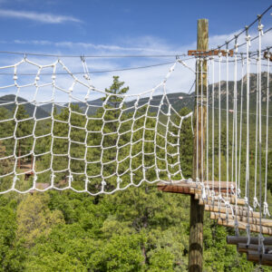 PTC participants and family camp explore the high ropes course at rocky mountain scout camp on 611. bouldering